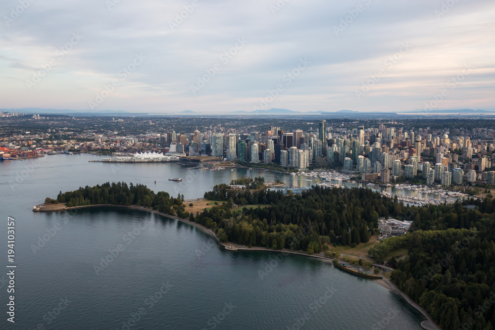 Fototapeta premium Aerial view of Brockton Point Lighthouse in Stanley Park with Downtown Vancouver City in the background. 