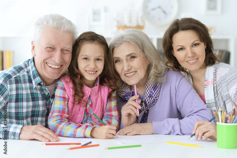 Big family with cute little girl doing homework Big family with cute little girl doing homework