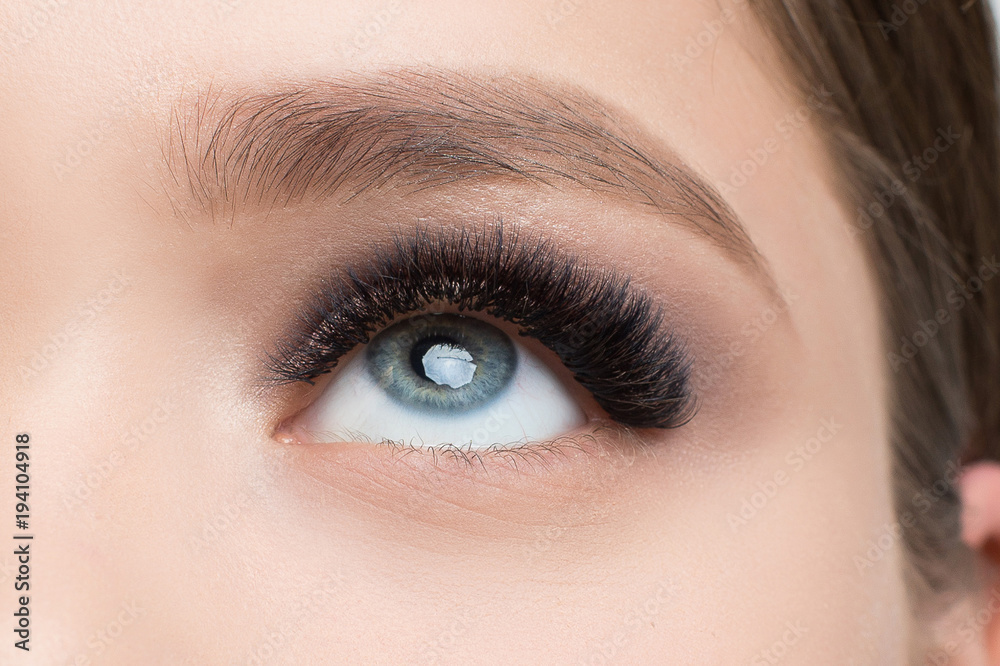 Closeup image of beautiful woman eye with fashion makeup and long eyelashes Closeup image of beautiful woman eye with fashion makeup and long eyelashes