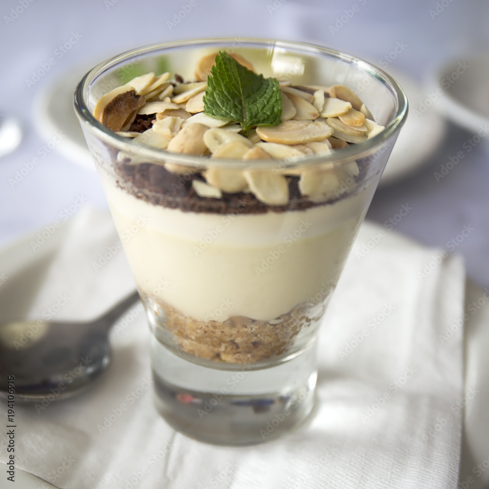 Banana mousse with peanut chips in a glass. Delicious dessert. Banana mousse with peanut chips in a glass. Delicious dessert.