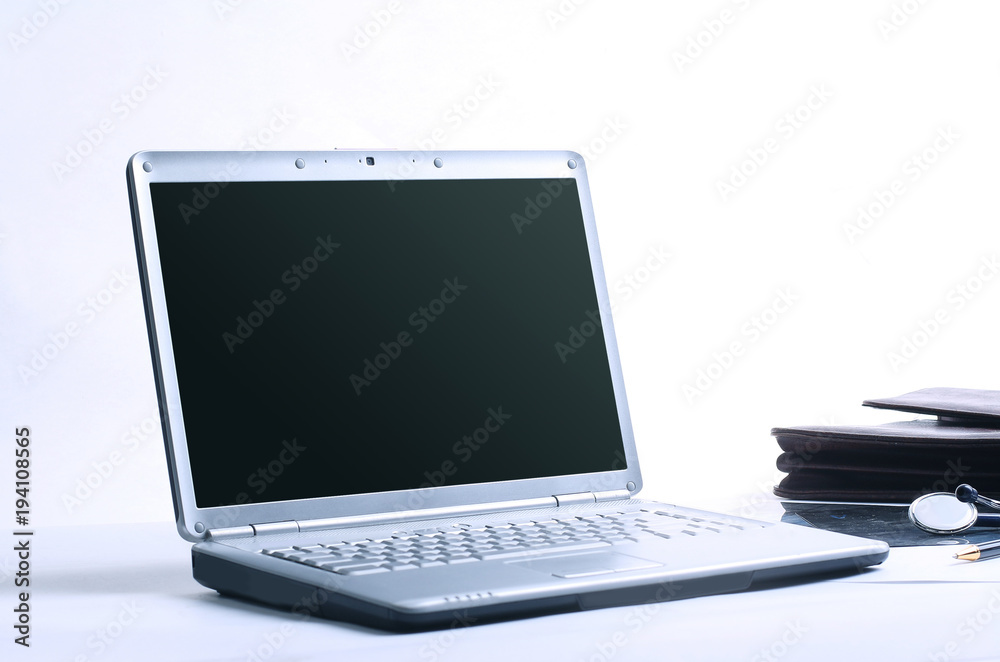 closeup.open laptop on the workplace of the doctor closeup.open laptop on the workplace of the doctor