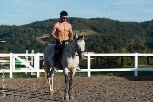 Man Riding a Horse on Beautiful Sunny Day © Jale Ibrak