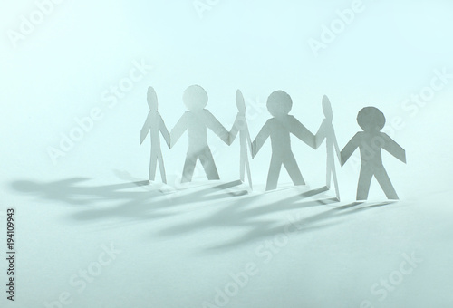 concept of teamwork.team paper men standing