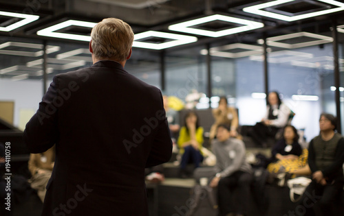 Business Professional Person Presenting to a Group of People. Discussion. photo