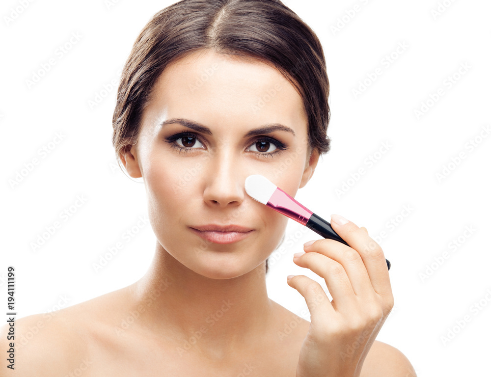 Smiling woman with make up brush, isolated Smiling woman with make up brush, isolated