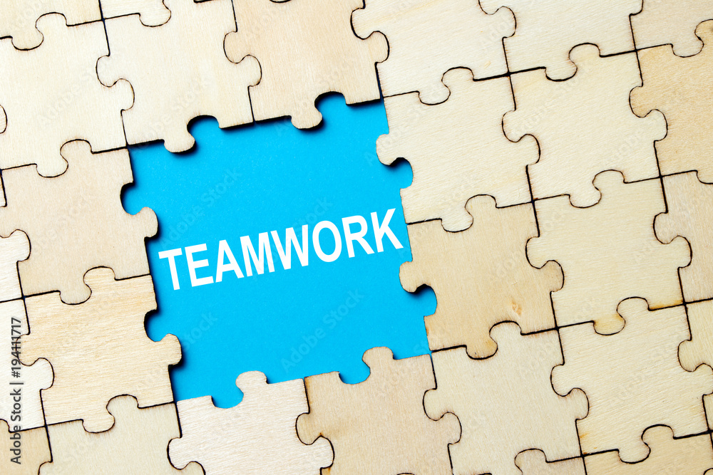 Jigsaw puzzle pieces with word teamwork on grey background Jigsaw puzzle pieces with word teamwork on grey background