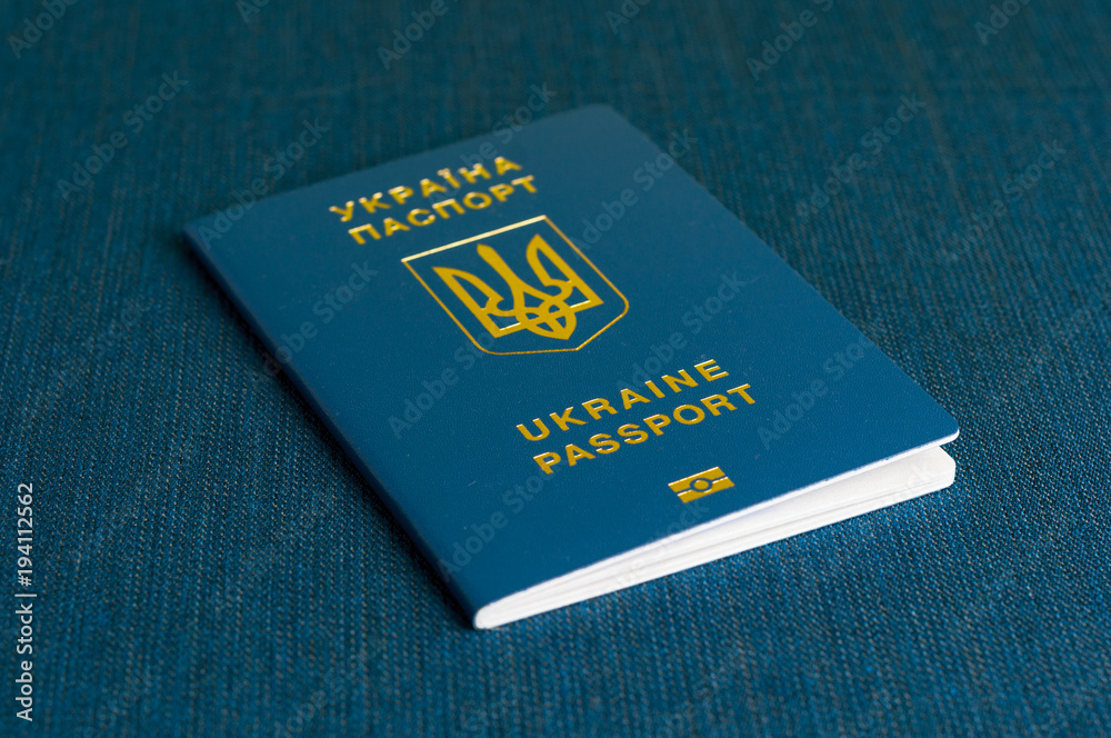 Ukrainian passport on a blue background. Ukrainian passport on a blue background.