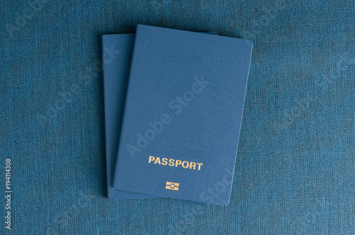 Several Blue clean passports on a blue background.