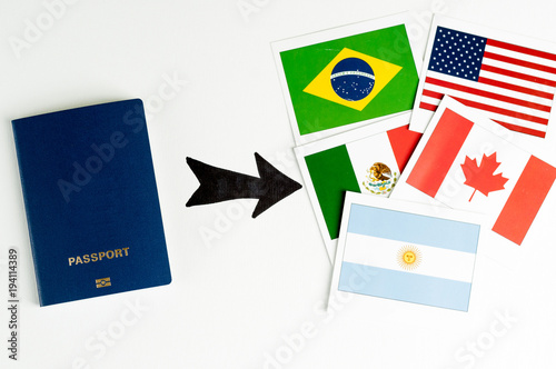 Blue clean passport  and several cards with prapors of the world. Says on a white background. Isolate.