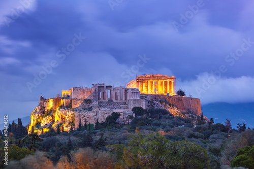 Aerial view of the Acropolis Hill, crowned with Parthenon during evening blue hour in Athens, Greece
