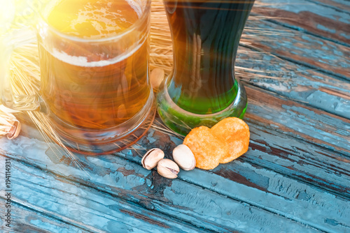 pistachios and chips lying on a painted old table photo