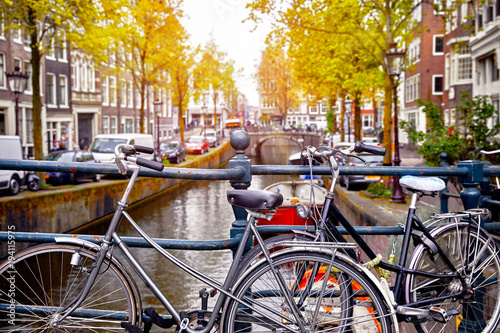 Canvas Print Bike over canal Amsterdam city. Picturesque town landscape