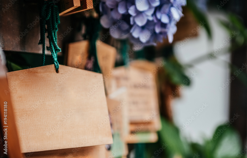 Empty Ema Wooden Wishing Plaques Japanese style wishing tablet at shinto shrine or temple with copyspace Empty Ema Wooden Wishing Plaques Japanese style wishing tablet at shinto shrine or temple with copyspace