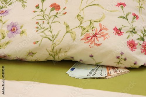 hidden money in bed under the pillow