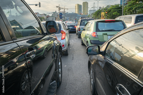 Cars on city street in traffic jam at rush hour © Hanoi Photography
