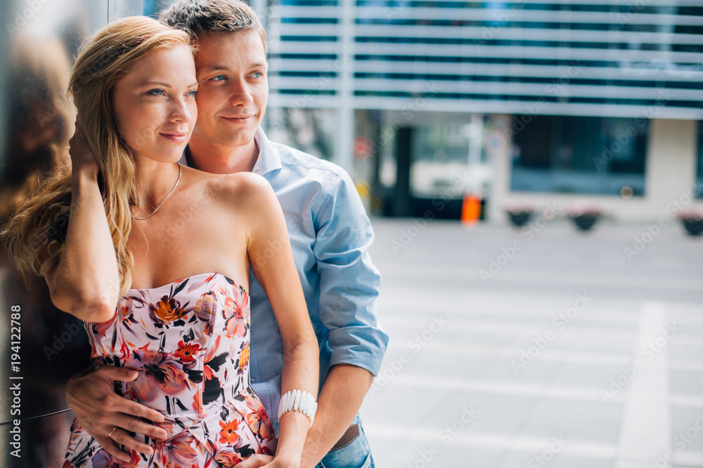 Fototapeta premium close up portrait of stylish couple in love on the street. Pretty man and gorgeous woman hugging.