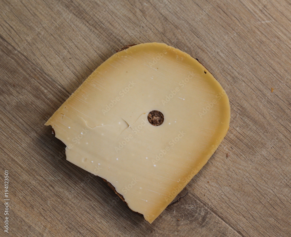 Slice of bread with cheese on wooden background in ktichen Slice of bread with cheese on wooden background in ktichen