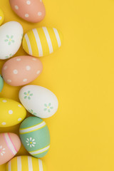 Painted easter eggs on a bright yellow background
