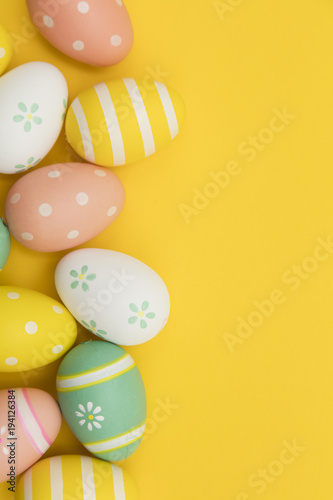 Painted easter eggs on a bright yellow background