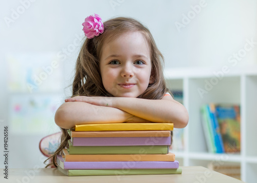 Happy child girl with a sta...