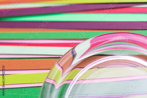 Multicolored strips of colored paper as a background