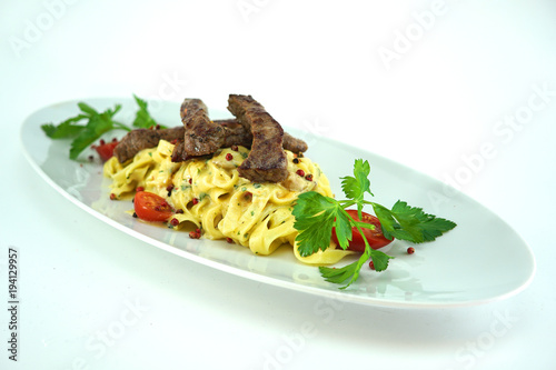 grilled pork meat with pasta