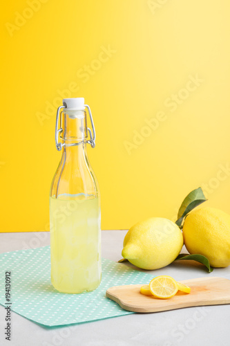 llemonade on a light background. summer traditional Italian home-made drink from Sicilian lemons. a drink of yellow color. articles made of fruits. summer background with a picture of a drink photo