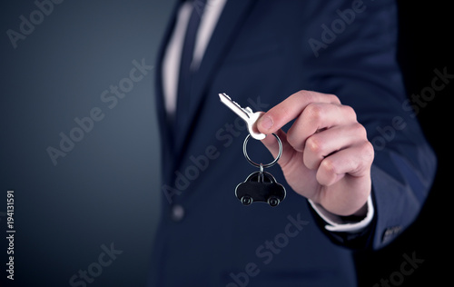 Young man hand over keys