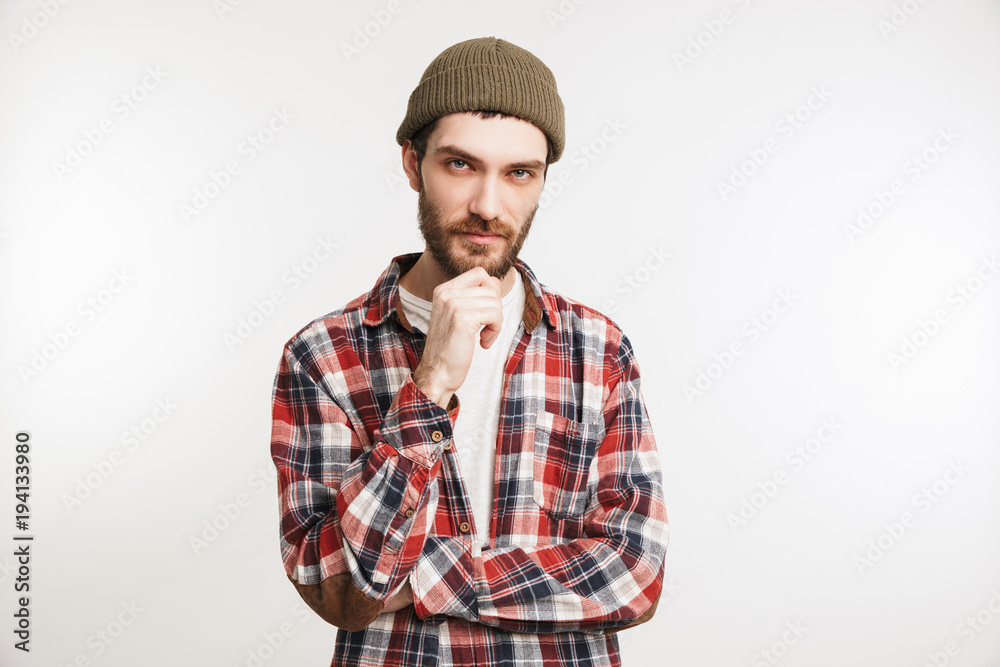 Portrait of a pensive bearded man in plaid shirt Portrait of a pensive bearded man in plaid shirt