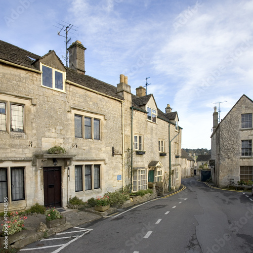 England, Gloucestershire, Cotswolds, Painswick, cotswold stone houses, autumn sun, street scene