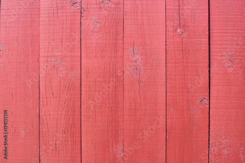 Flat wooden boards. Bright coating. Red paint