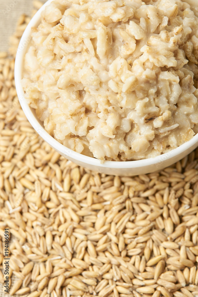 Neutral light background. Raw porridge. Welded porridge Neutral light background. Raw porridge. Welded porridge