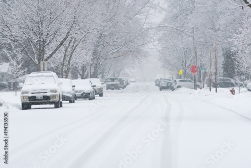 Fototapeta Naklejka Na Ścianę i Meble -  Suburban street covered in heavy winter snow