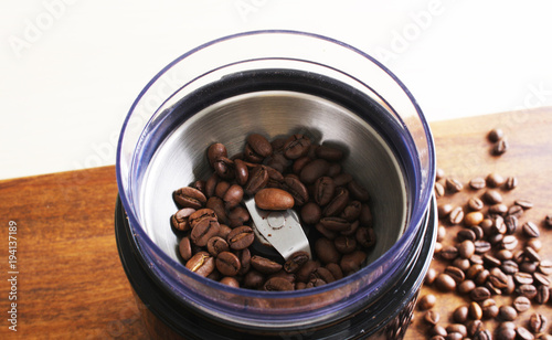 coffee beans in an electric coffee grinder
