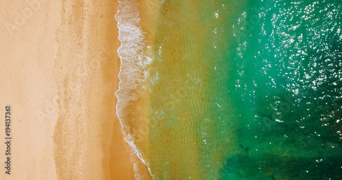 Aerial View From Flying Drone Of Ocean Waves And Beautiful Beach In Algarve, Portugal