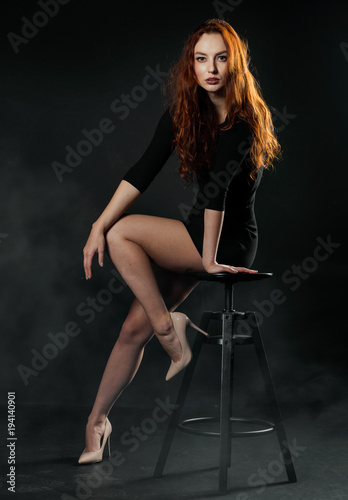 sexy full-length model on a dark background © kavardakova