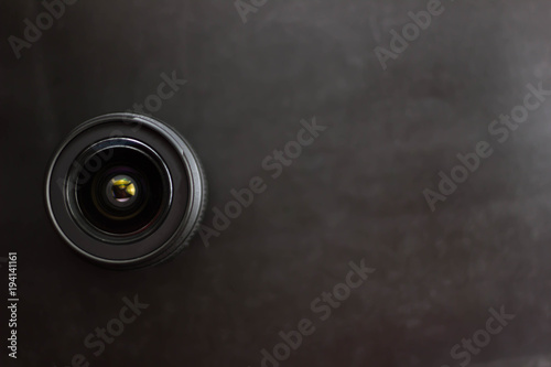 Closeup of camera lens over black background