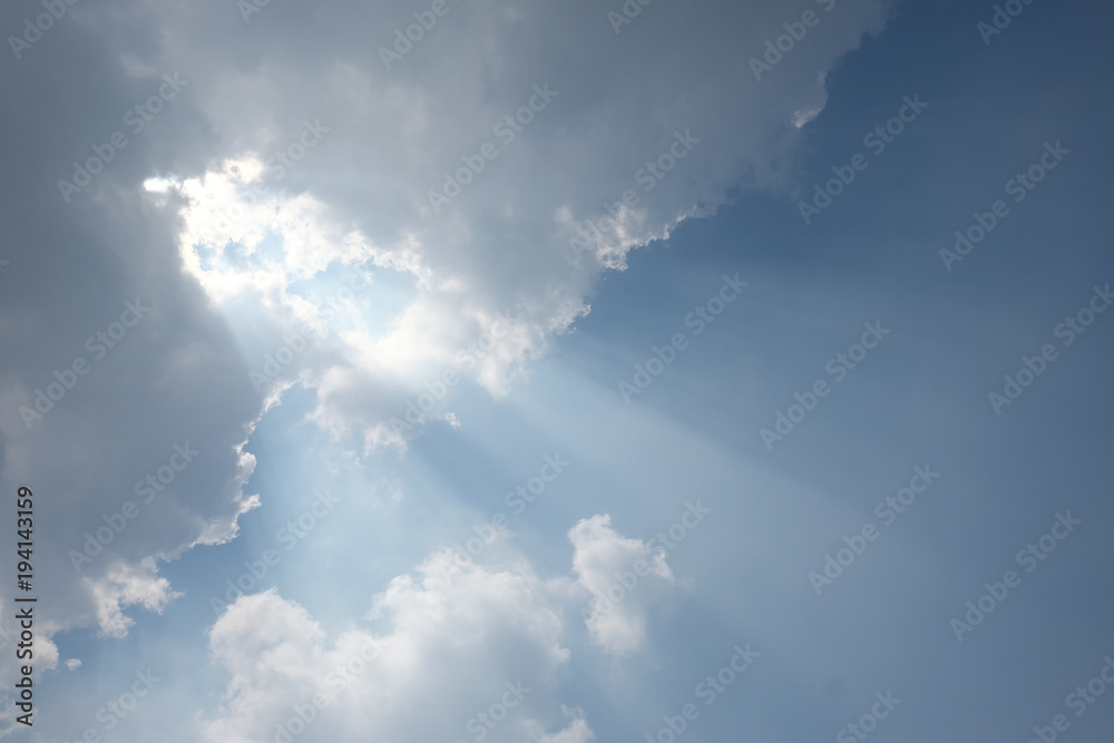 blue sky and clouds with sun rays