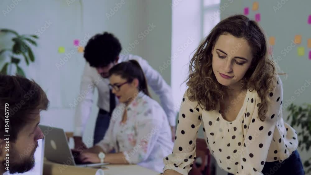 Group of young people working together in an office. Group of young people working together in an office.