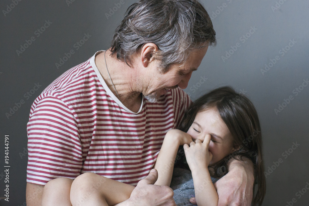 The look of a happy loving dad to his daughter The look of a happy loving dad to his daughter