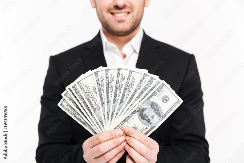 Cropped image of a smiling young businessman Cropped image of a smiling young businessman