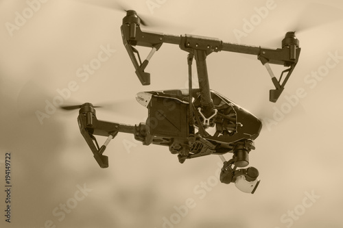 one flying small drone in a dark sky in retro style