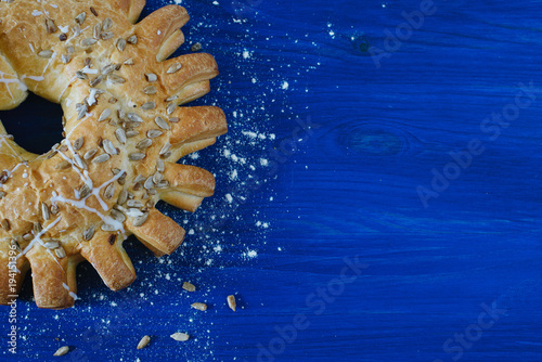 Round baked pie on a blue background photo