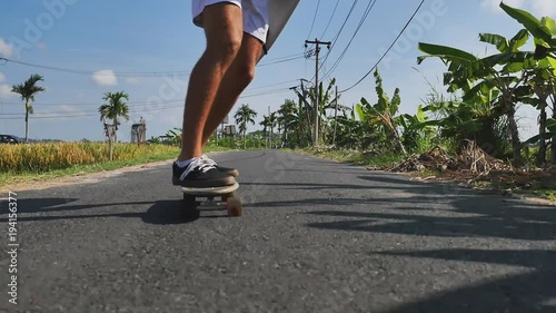 Man gonna surf spot on motorcycle with surfboard. Surfing lifestyle