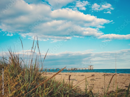 A view from the sandy Black sea beach to the bridge in Bourgas, Bulgaria