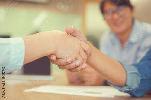 close up businesswoman handshake with partner,ceo leader hand shake for agreement or approve or deal financial concept