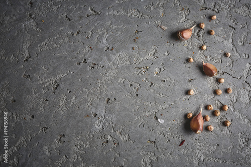 chickpea and garlic on the grey concrete backdrop