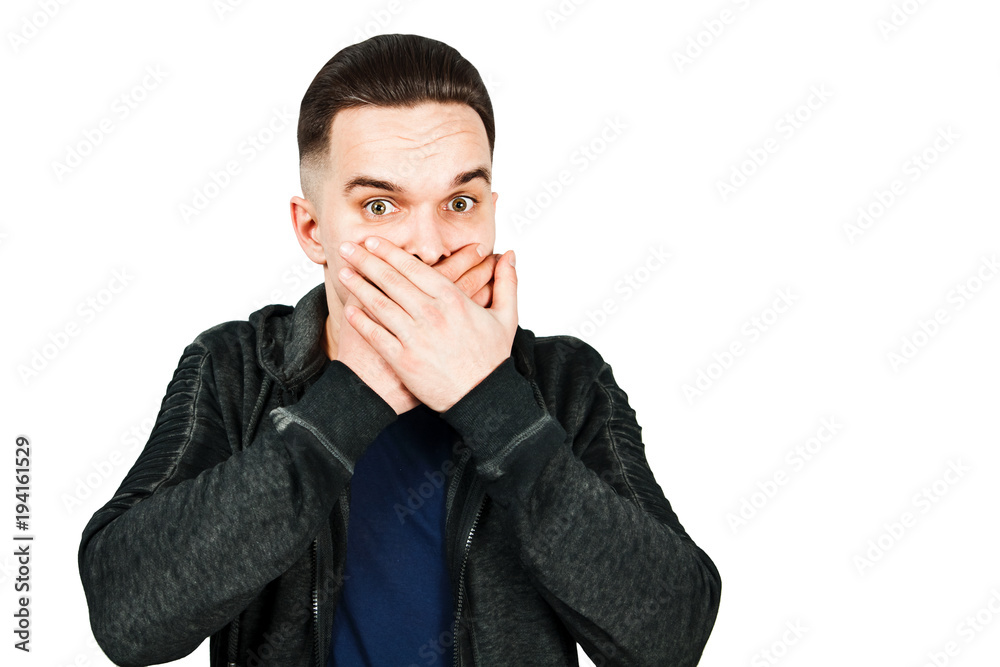 Portrait of young man scared and closes mouth hands. Isolated on white. Portrait of young man scared and closes mouth hands. Isolated on white.