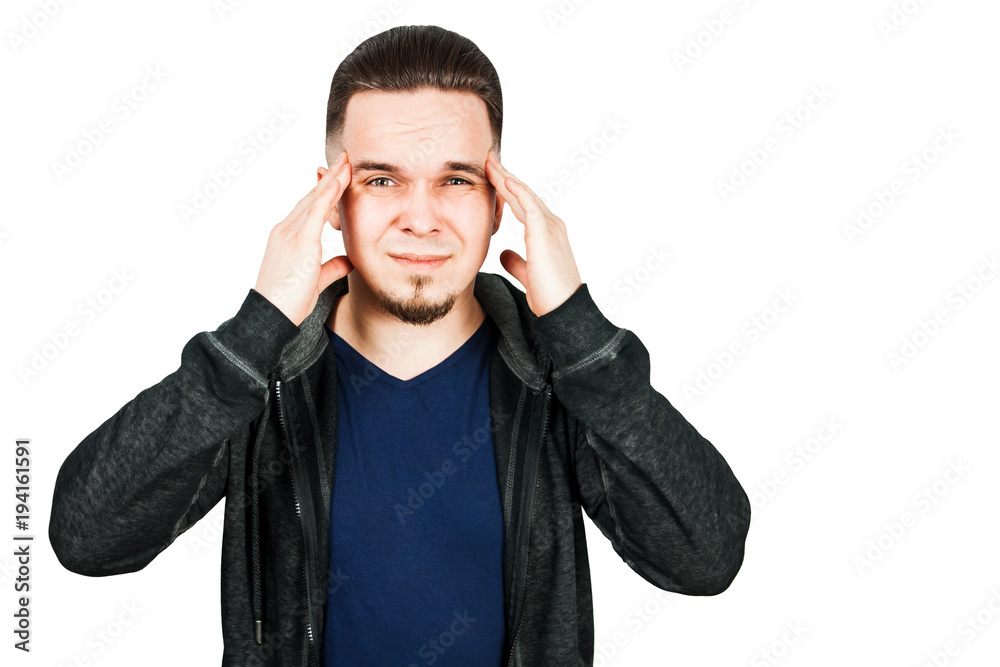 Worried bearded young man suffering from headache Worried bearded young man suffering from headache