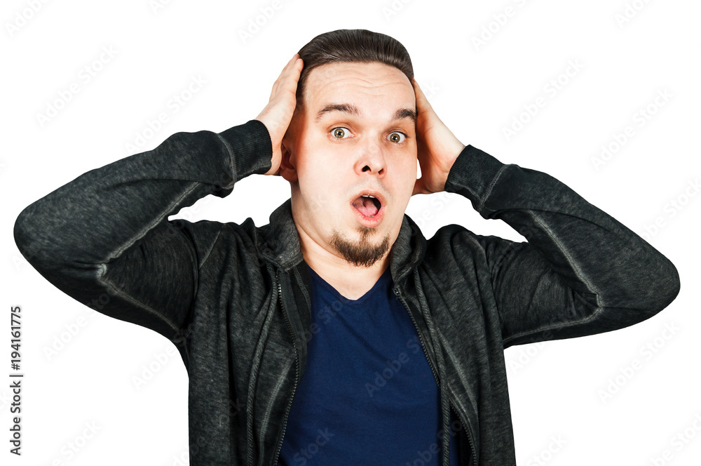 Portrait of young man scared, hold on to one's head and open mouth. Isolated on white. Portrait of young man scared, hold on to one's head and open mouth. Isolated on white.